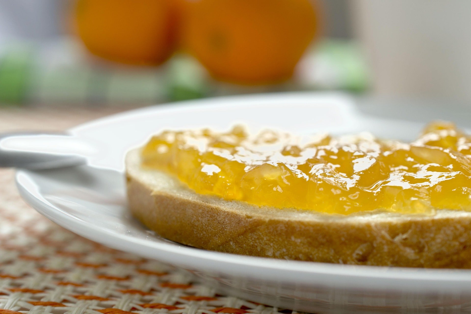 A slice of bread spread with jam