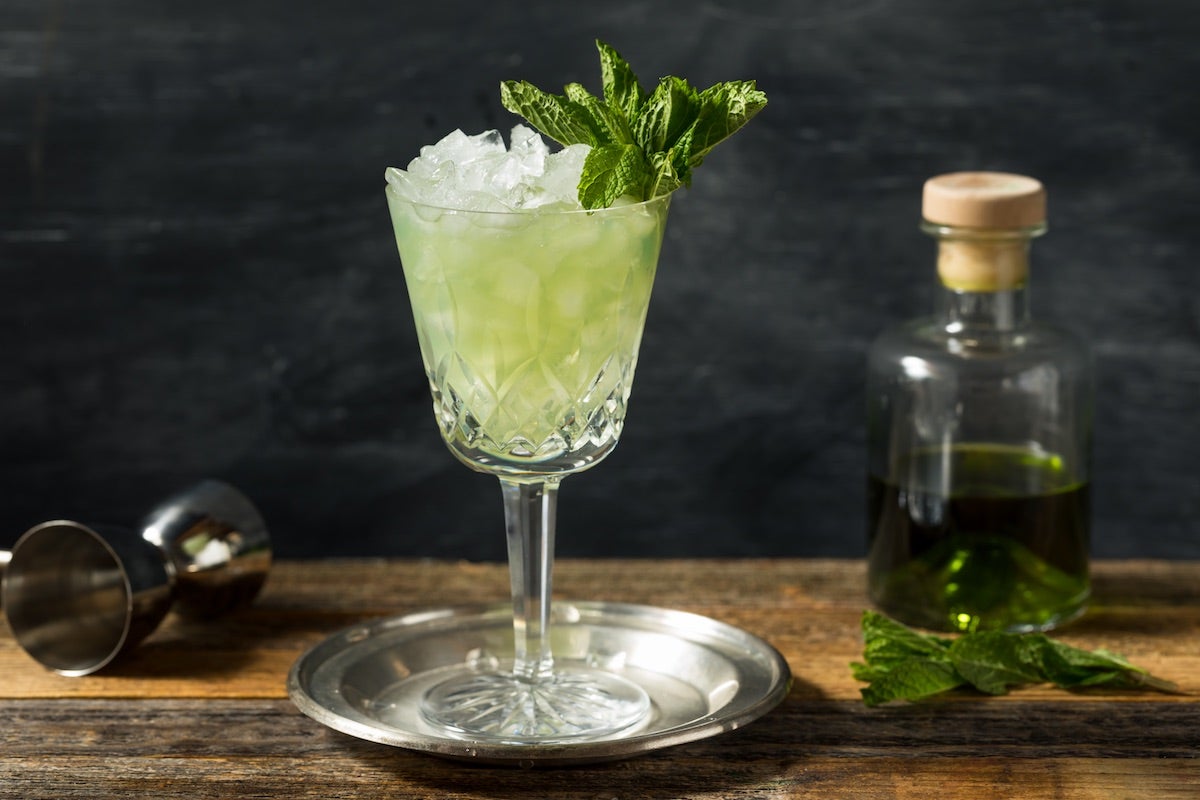 Glass of cocktail based on Absinthe herbal spirit