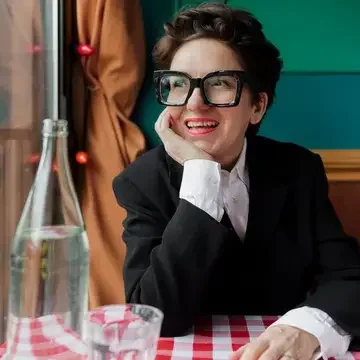 Food journalist Ivy Knight sat at a restaurant table.