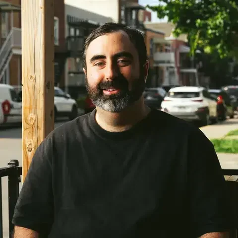 Chef Ari Schor in a black t-shirt.