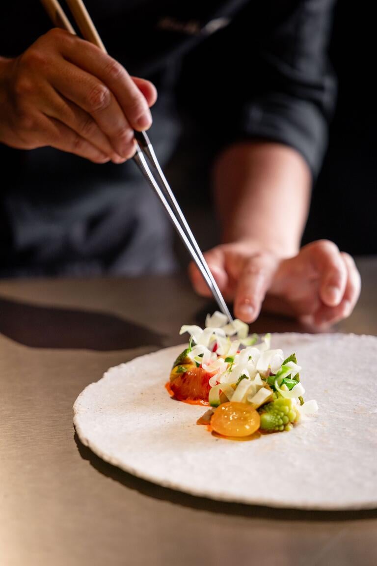 Using chopsticks on a dish at Sen in Monte Carlo.