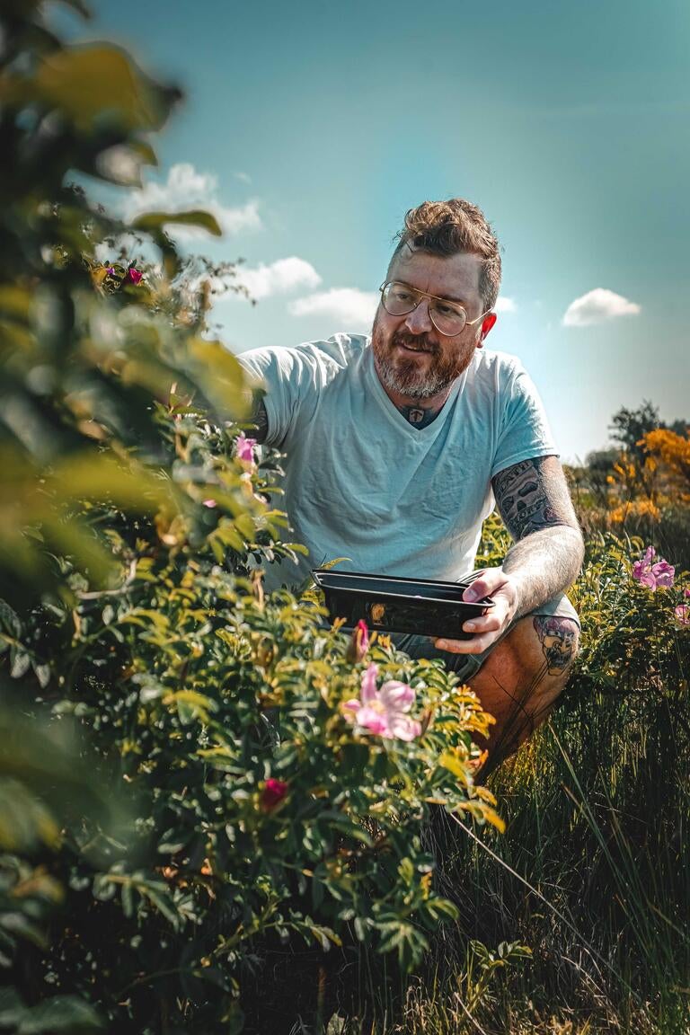 Chef Gus Stieffenhofer-Brandson in a garden.