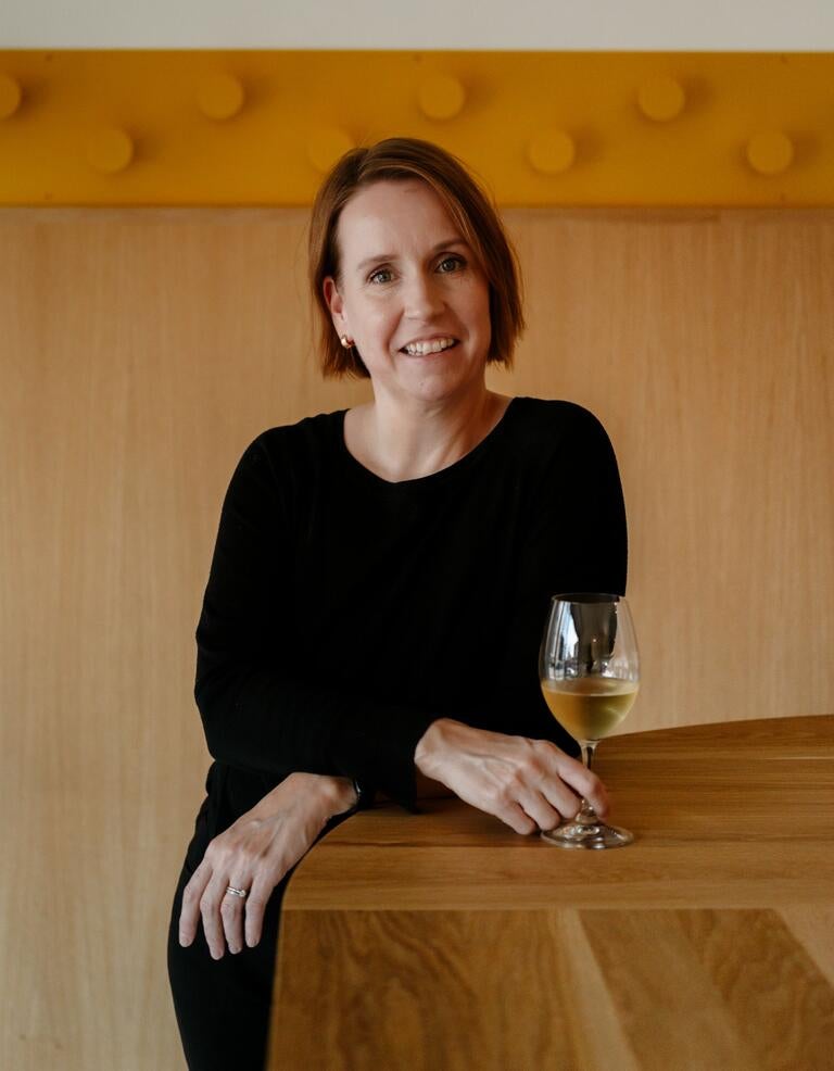 Sommelier Marie Josée Beaudoin with a glass of wine.