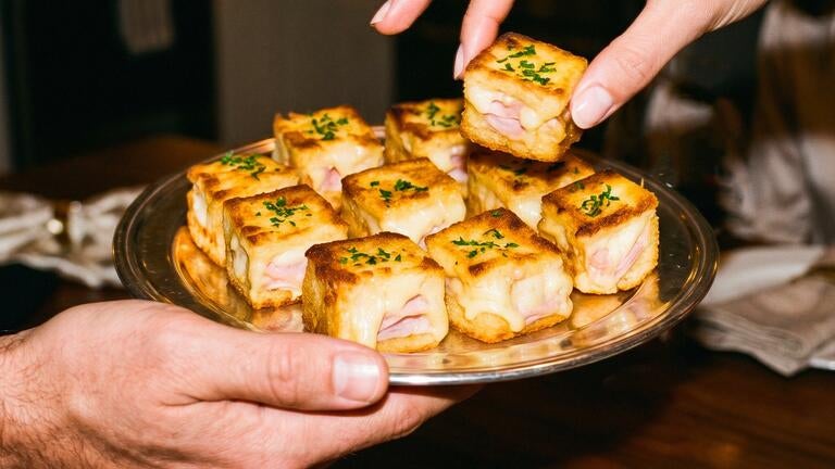 A platter of mini croque monsieurs.