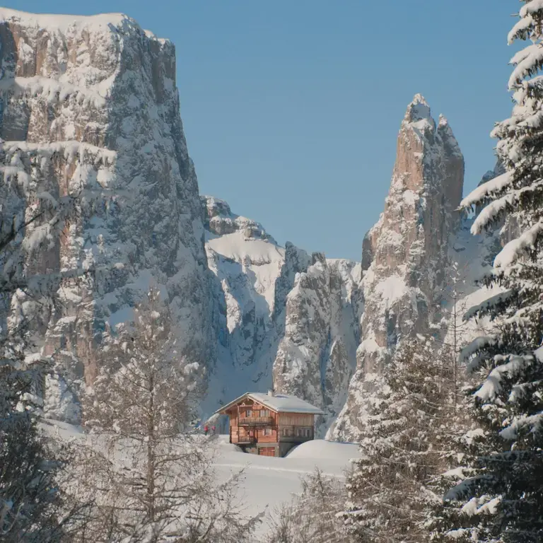 A mountain hut, near the snowy ski slopes of Alpe di Siusi