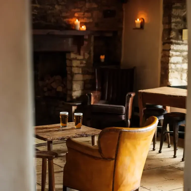 A table with two pints of beer at The Bull Charlbury.