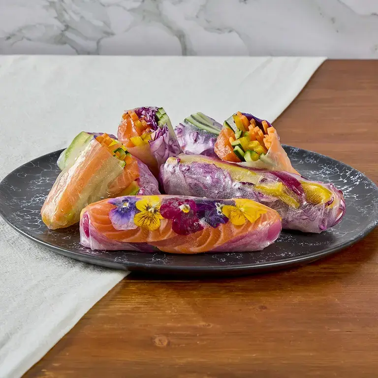 Fresh rolls on a plate on a table.