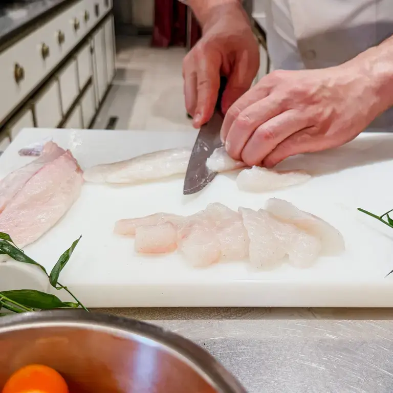 Slicing sea bass at Langosteria.