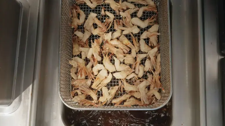 Artichokes in the fryer basket before cooking