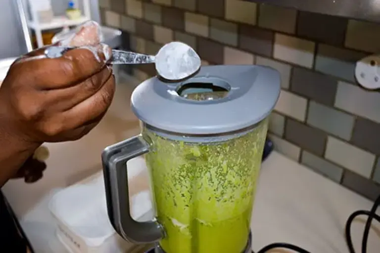 Spinach in a blender by Callan Austin