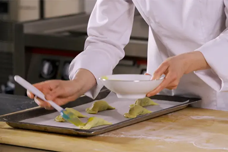 Brush the empanadas