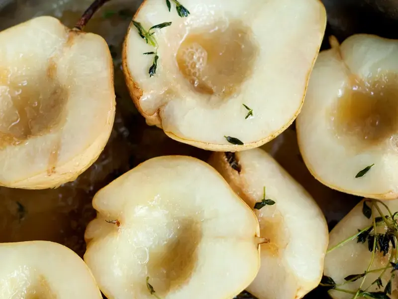 a selection of peeled and halved overripe pears