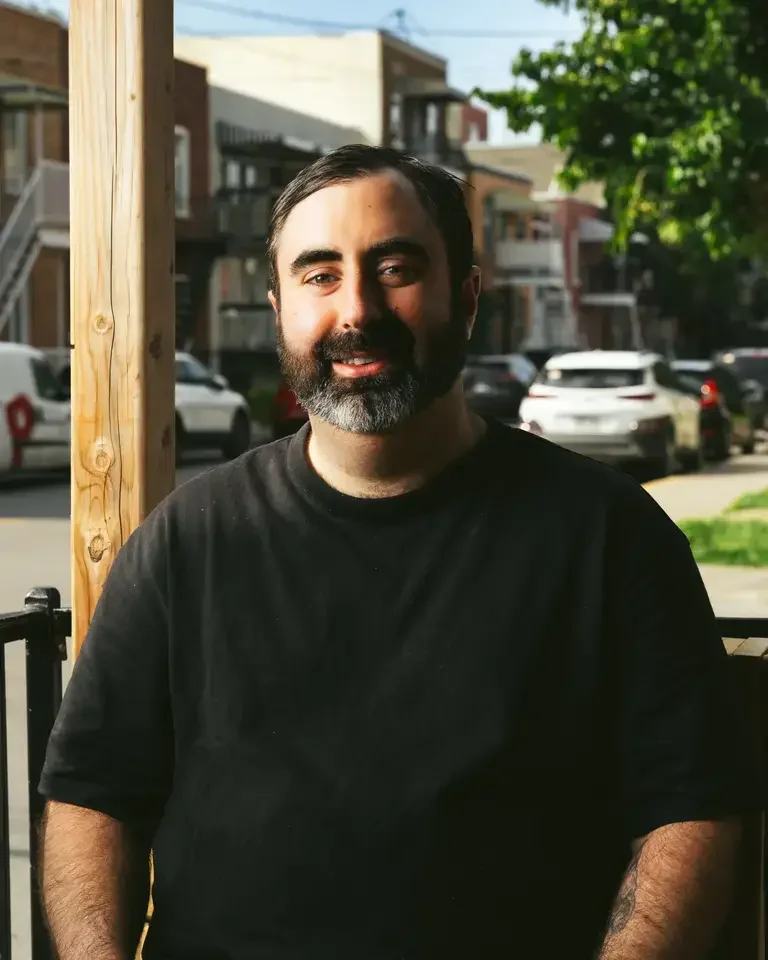 Chef Ari Schor in a black t-shirt.